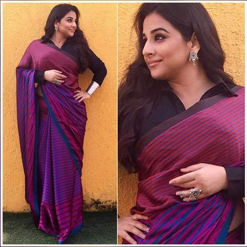 Vidya Balan in a multi coloured saree with black collar blouse.
