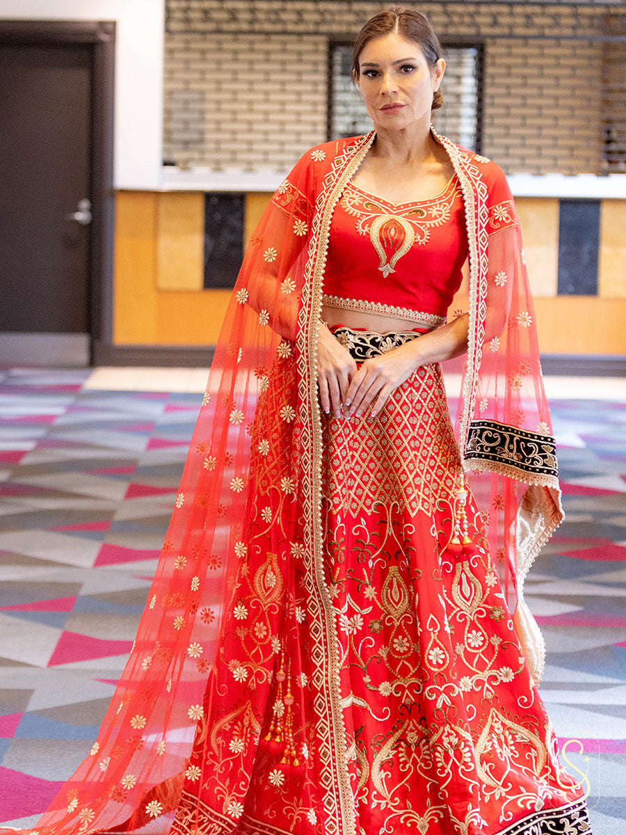 A woman in a fully zardozi embroidered lehenga set.