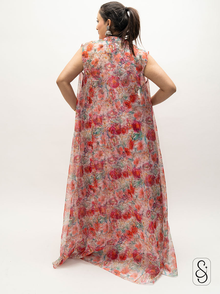 Back view of a woman wearing a floral dress with jacket.
