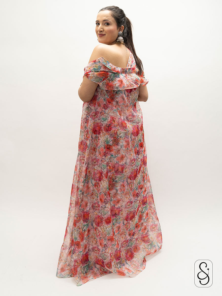Woman wearing a floral one-shoulder dress on a white background