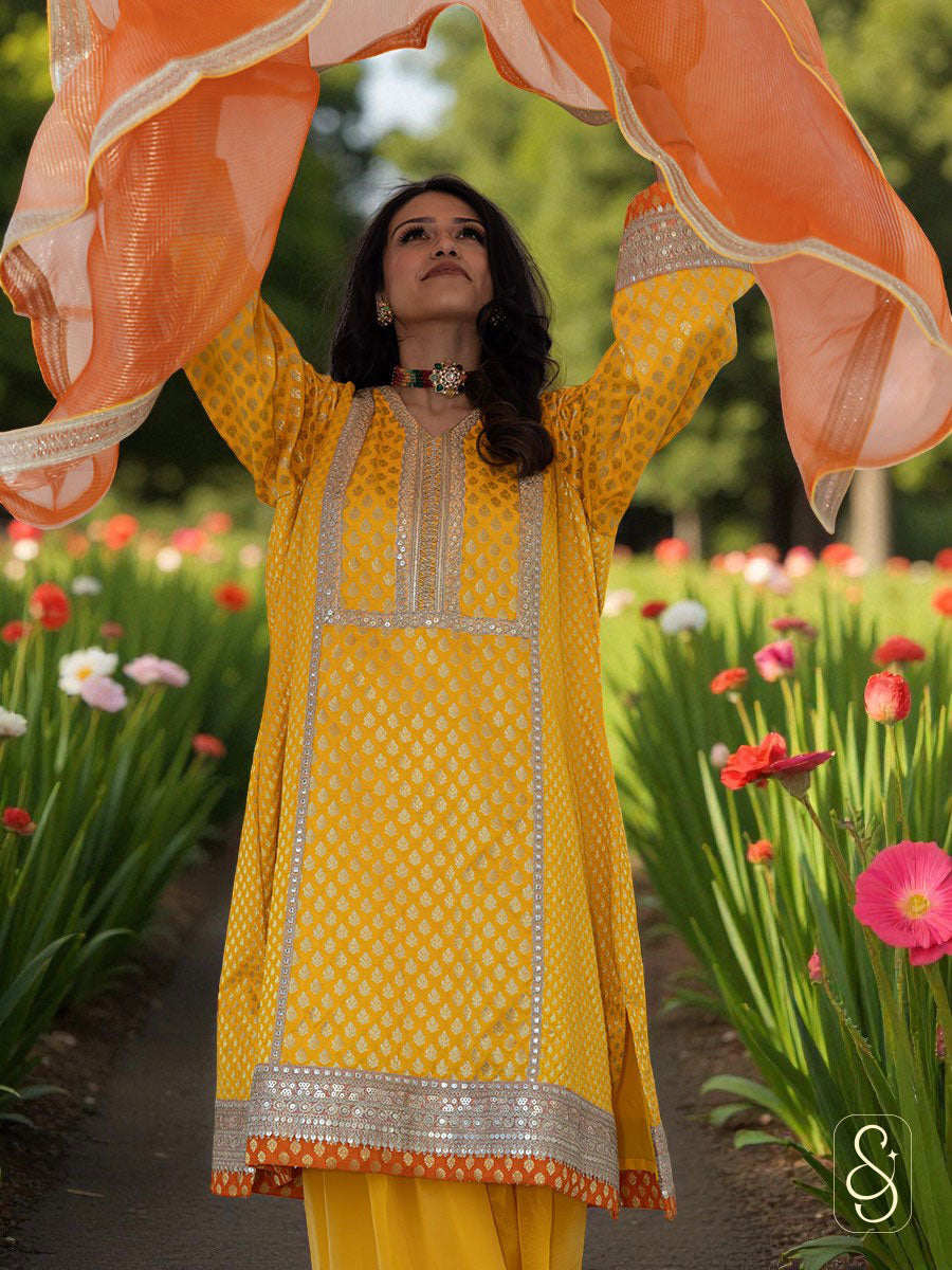 Woman in a yellow traditional outfit with floral background