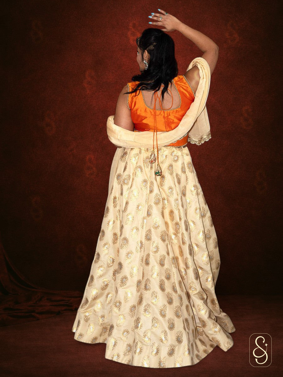 Off-White Brocade Lehenga With Orange Silk Blouse