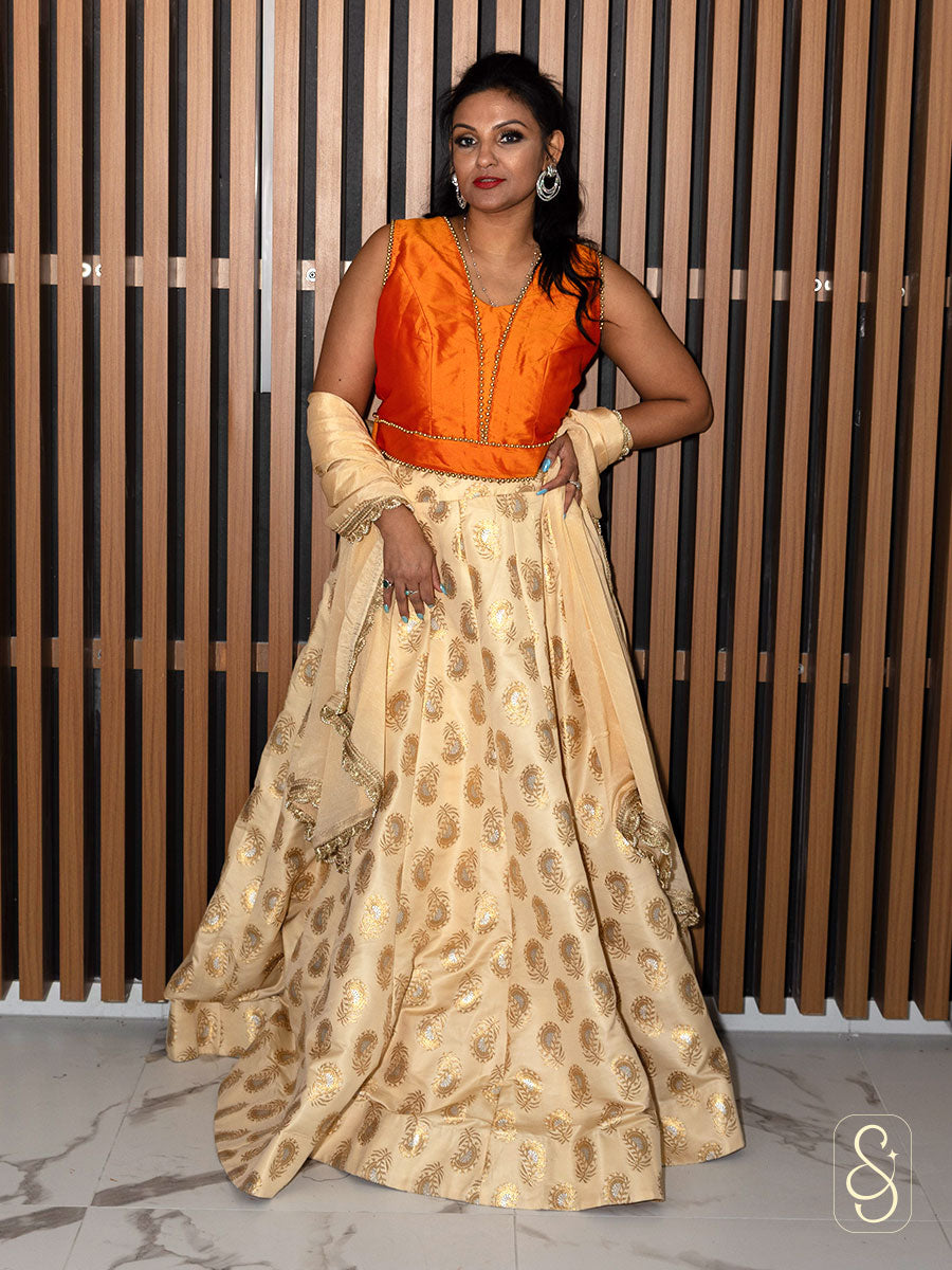 Off-White Brocade Lehenga With Orange Silk Blouse