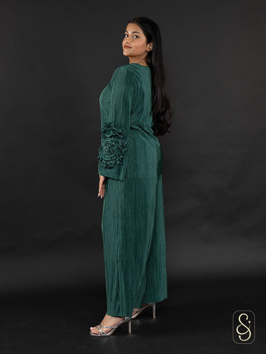 Side view of a woman wearing a green co-ord set with high heels.