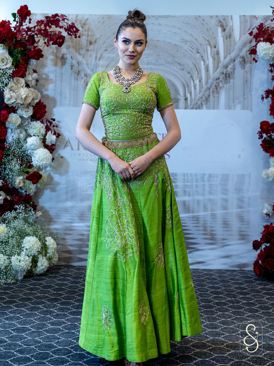A light green coloured bead embodied silk lehenga and blouse.